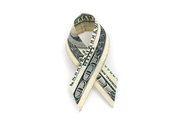 U.S. $100 bill folded into the shape of a cancer ribbon.